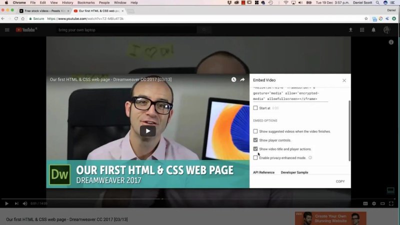 YouTube video embed options dialog displaying an HTML iframe code block and display toggles.