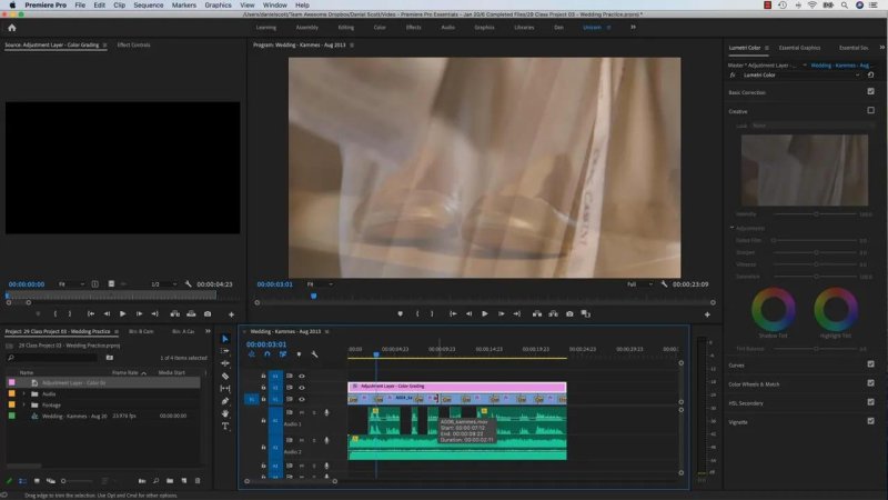 Premiere Pro workspace with the adjustment layer selected on track V2, ready for global color adjustments in the Lumetri Color panel.