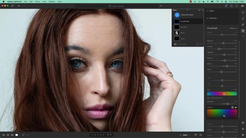 Portrait in Adobe Lightroom featuring bright blue eyes, with the Masks panel on the right showing the Iris and Pupil layer selected along with tonal and color sliders.