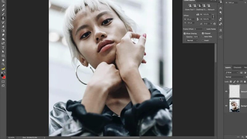 Photoshop workspace showing a portrait of a blonde model with hoop earrings, with the Clone Source panel open displaying an adjusted angle of negative 31.8 degrees.