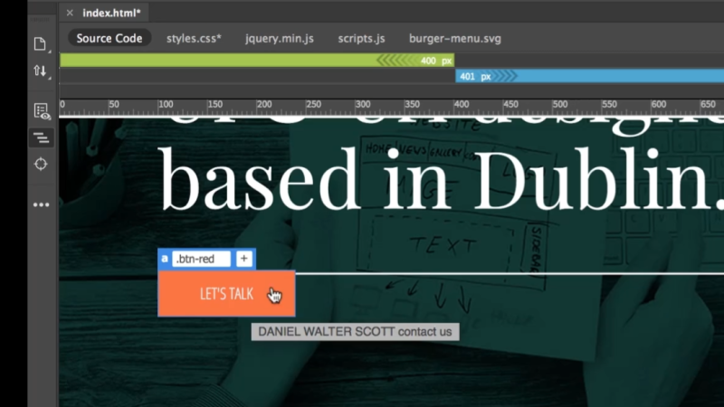 Dreamweaver Live View interface showing an orange button labeled LET'S TALK with an active blue tag selector popover reading a .btn-red positioned over a hero section with the headline 