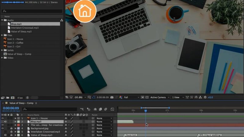After Effects composition window displaying an overhead desktop flat-lay background with an orange circular house icon, while the timeline shows the audio layer Blop.mp3 aligned beneath Icon 1 - House.