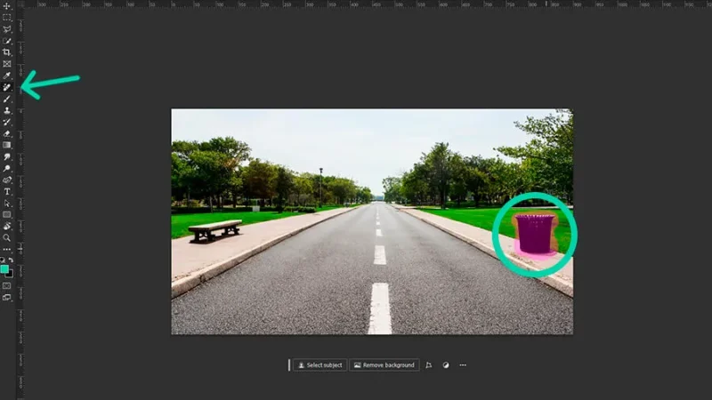 A photo of a two lane road with a trash can circled in adobe photoshop