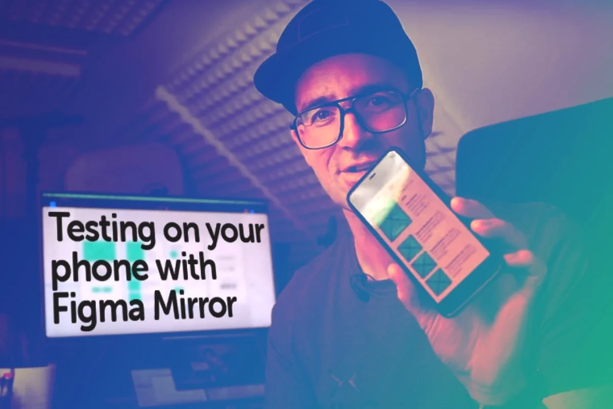 Dan Scott holding up a mobile phone with a figma design behind him a desktop computer has the font overlay Testing on your phone with figma mirror