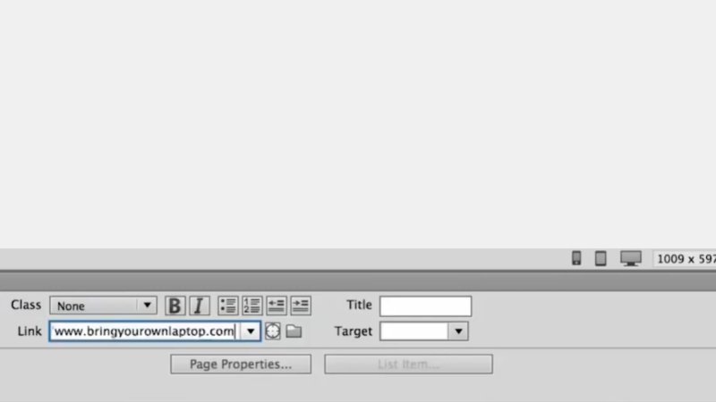 Close-up of the Adobe Dreamweaver HTML Properties panel showing the Link text input field populated with 