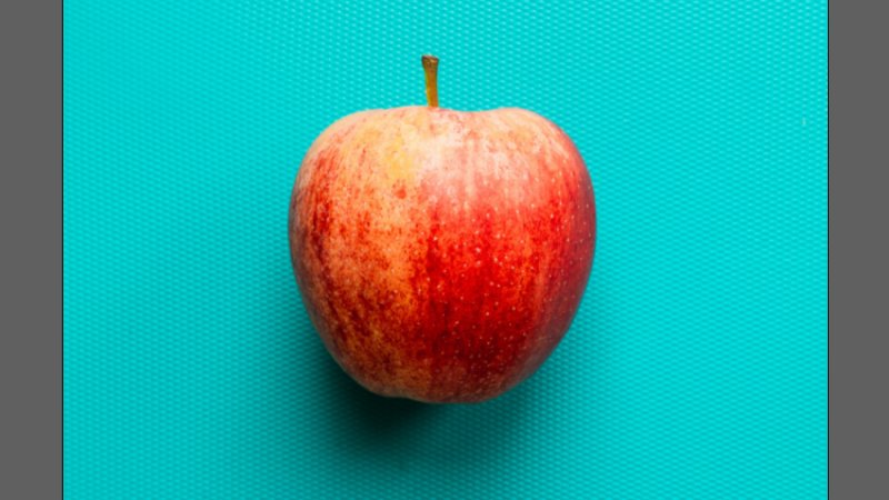image of a red apple placed on an illustrator artboard