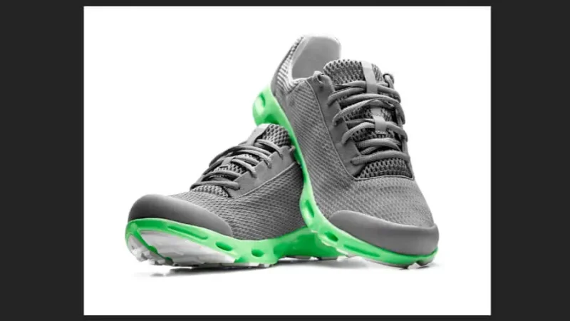 Running shoes with green highlights