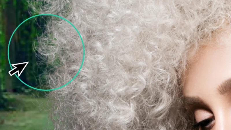 zoom detail of masked hair over a green background in canva