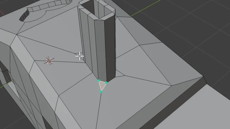 triangle face highlighted on a 3d model surface in blender