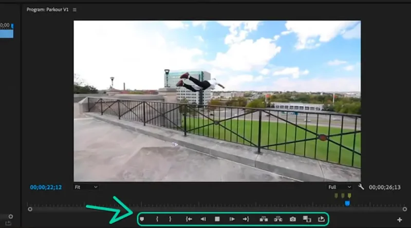 parkour video on program monitor and highlighted playback and editing buttons
