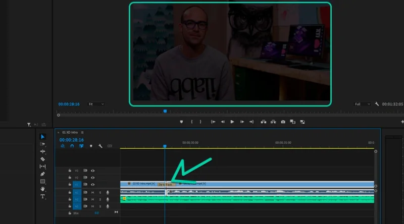 highlighted default transition connecting two clips in timeline in premiere pro